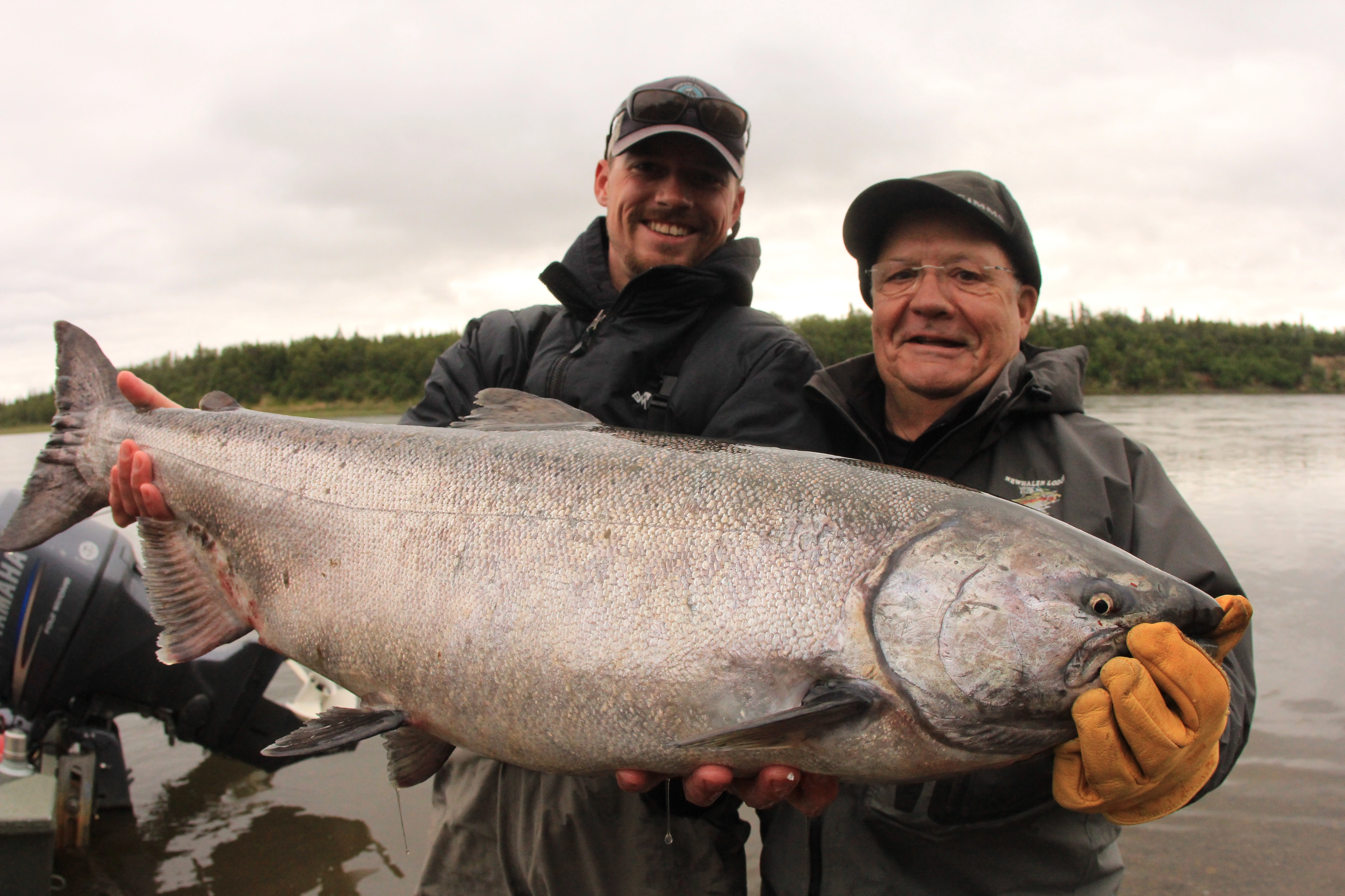 Trophy king salmon with guide and client